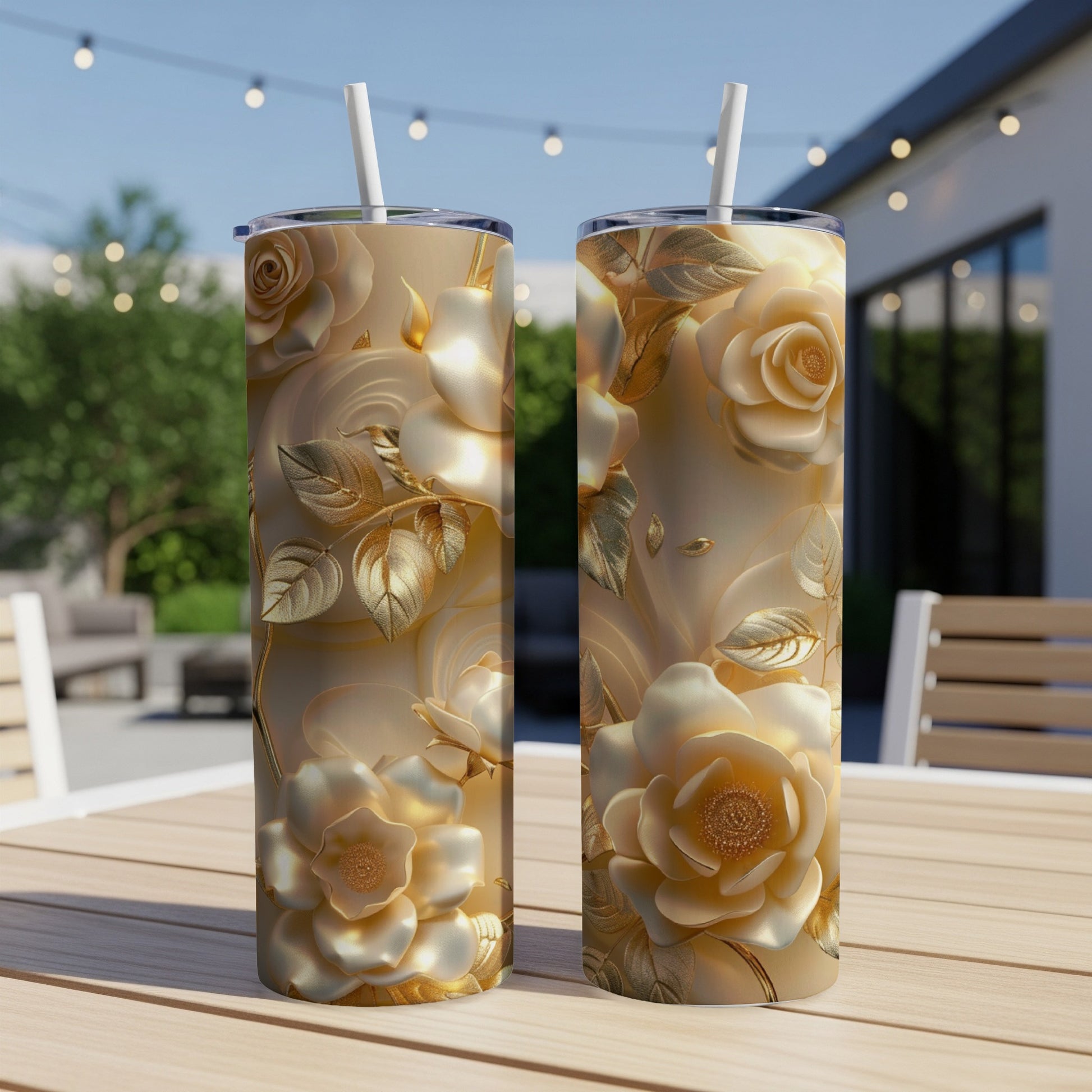 Two gold rose patterned tumblers on a wooden table with a backyard scene.