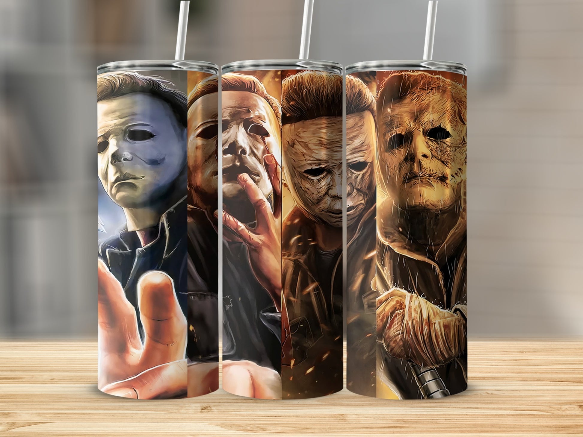 Three Michael Myers tumblers with different masks and expressions.