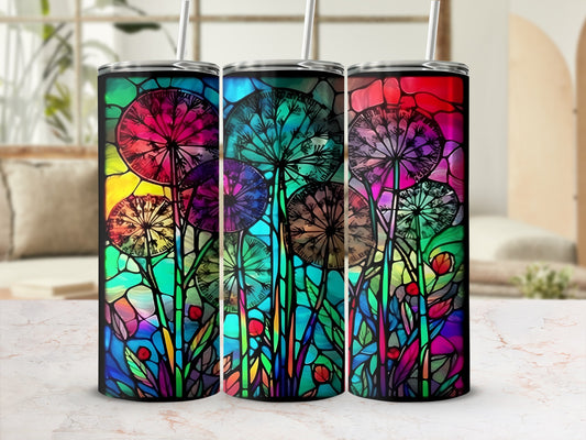 Three tumblers with stained glass dandelion designs on a countertop.