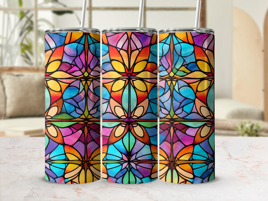 Three colorful stained glass pattern tumblers with straws.