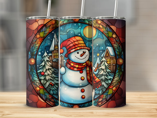 Three stained glass tumblers featuring a snowman and snowy village scene.