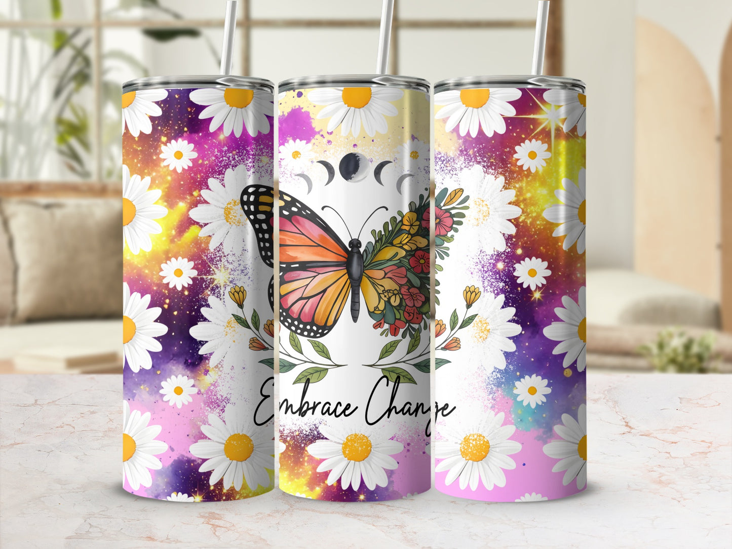 Floral butterfly tumbler with "Embrace Change" text and celestial moon phases.