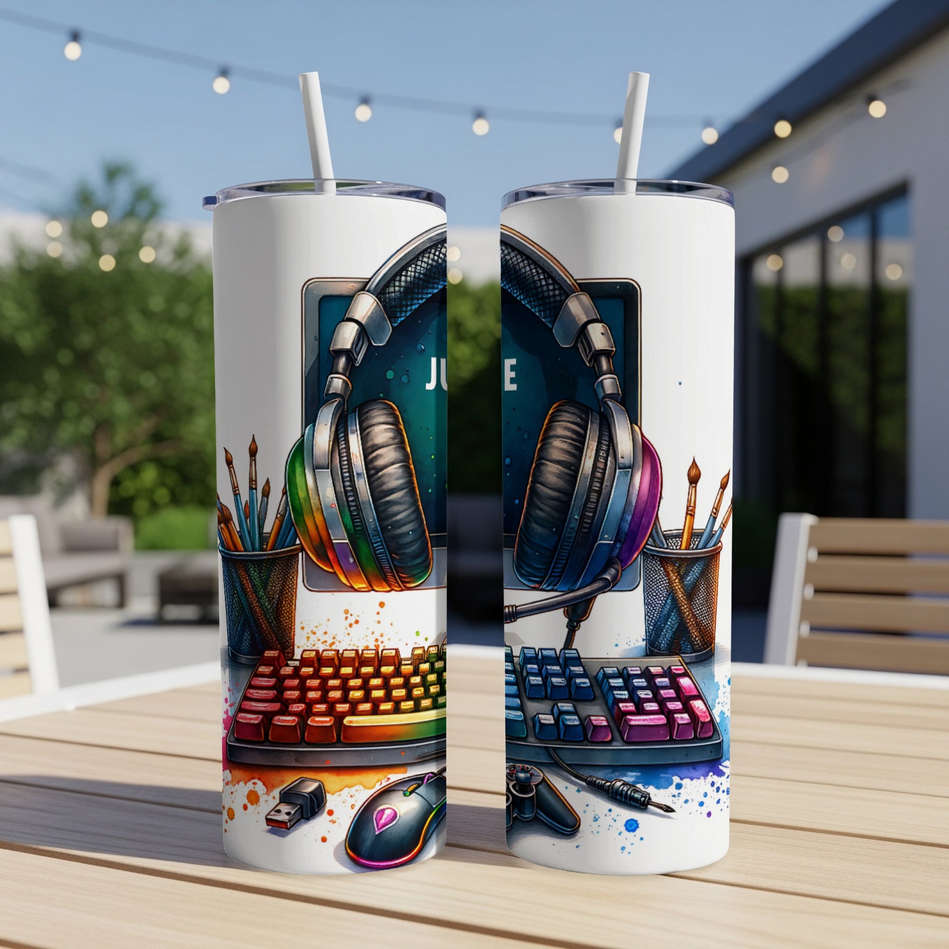 Computer, keyboard, mouse, and headphones with rainbow accents.