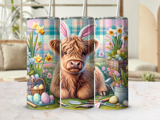 Highland cow with bunny ears and Easter eggs on a floral spring background.