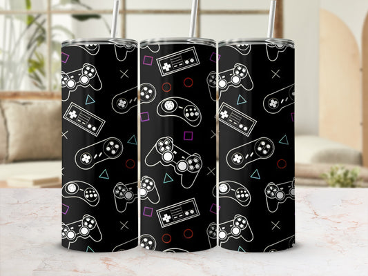 Black tumbler with repeating pattern of video game controllers and buttons.