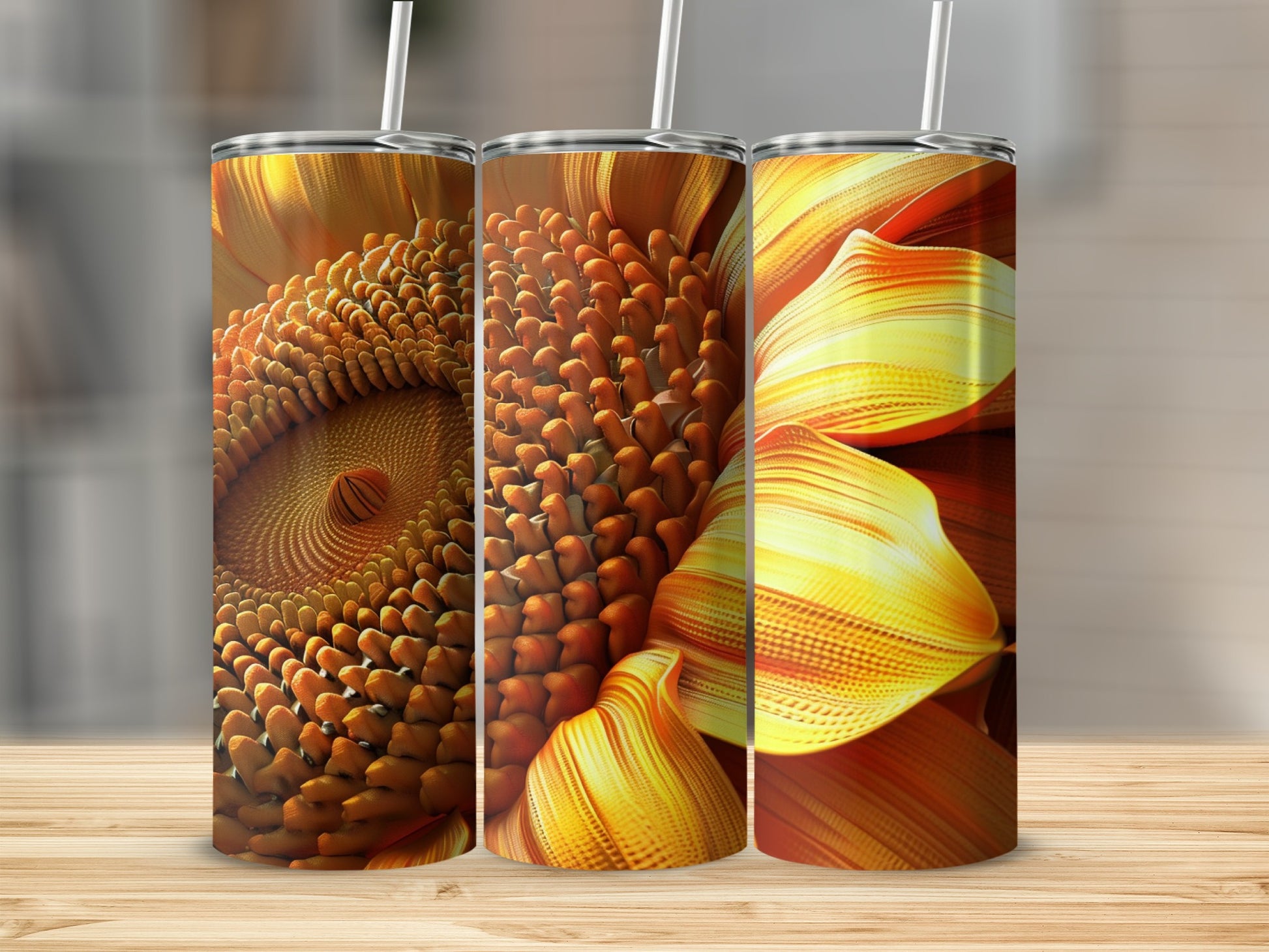 Three tumblers with abstract floral and seed patterns in orange and gold.