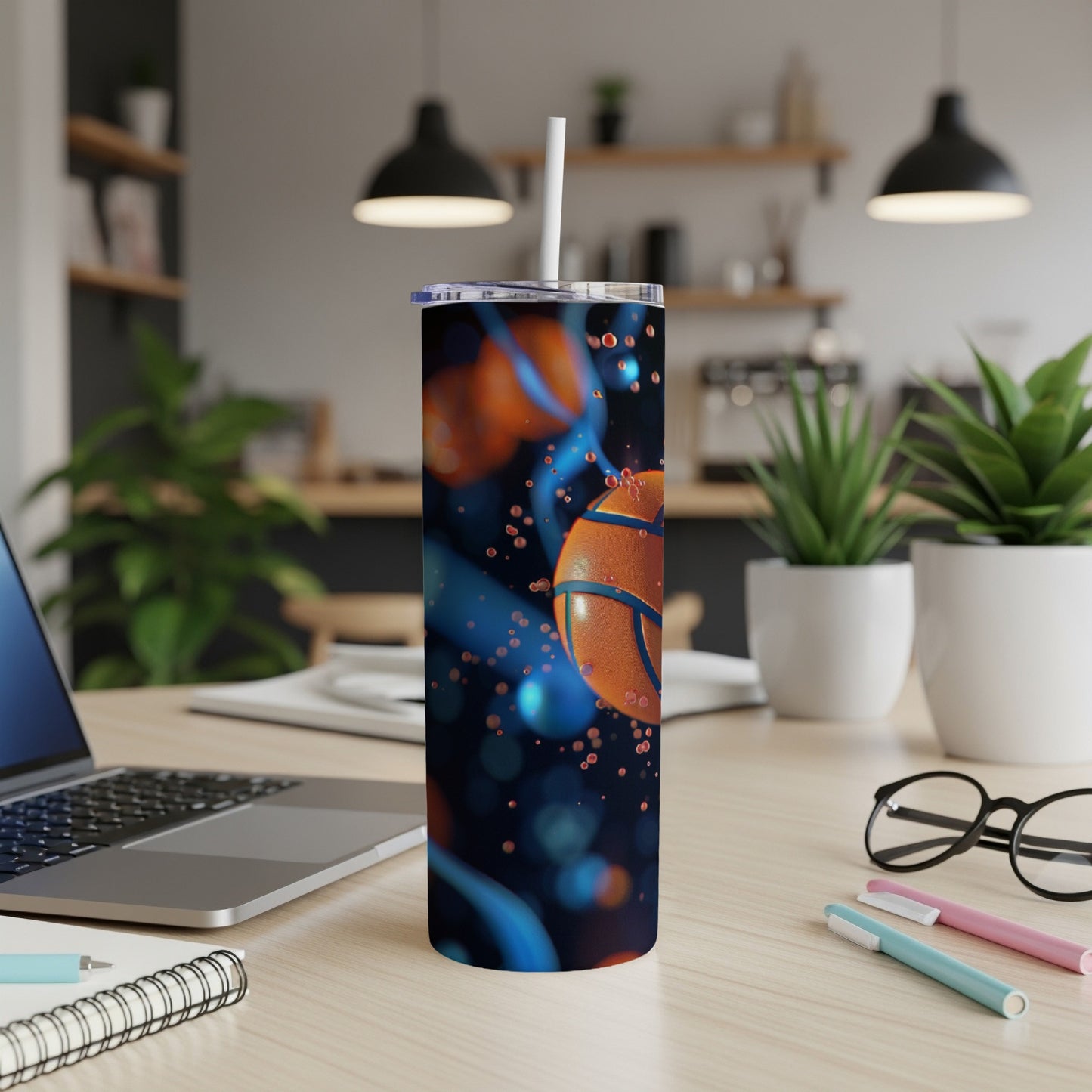 Basketball graphic on a dark blue tumbler with orange accents and a white straw.