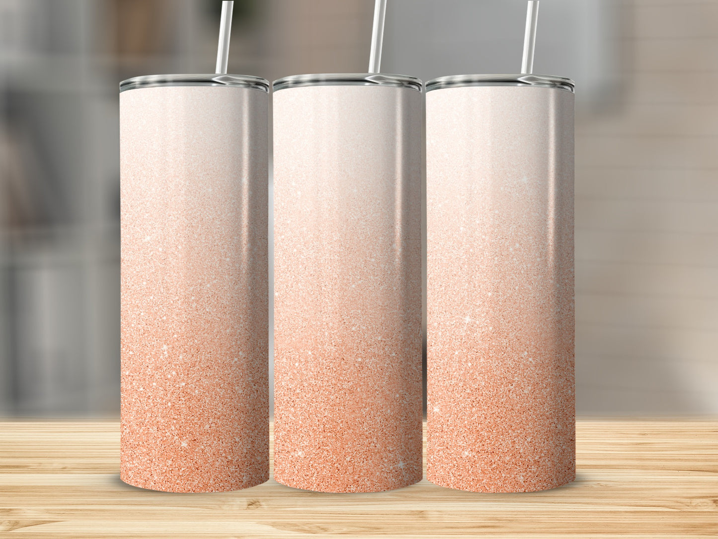 Three tall tumblers with a rose gold glitter gradient design.