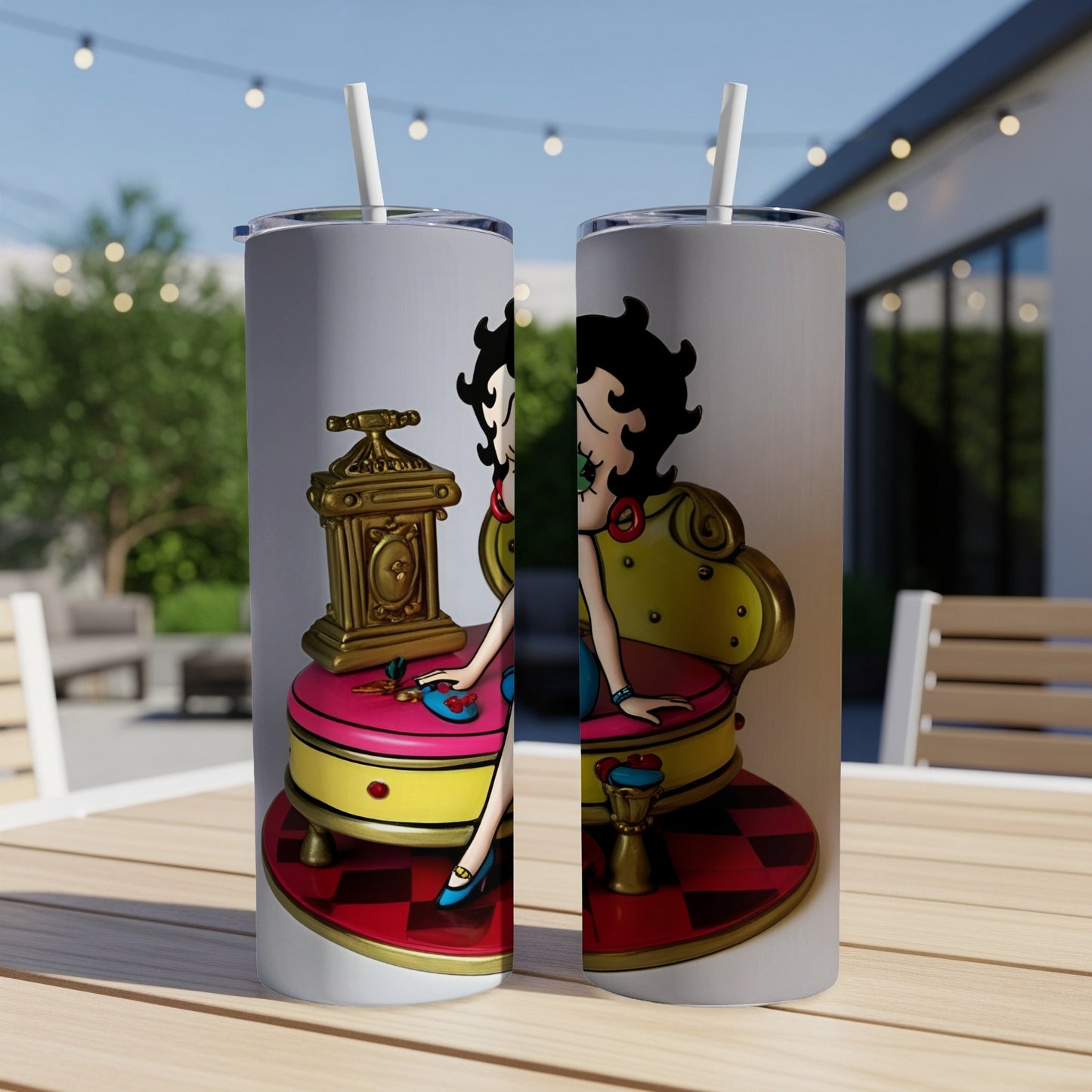 Betty Boop sitting on a gold chair on a pink cushion.
