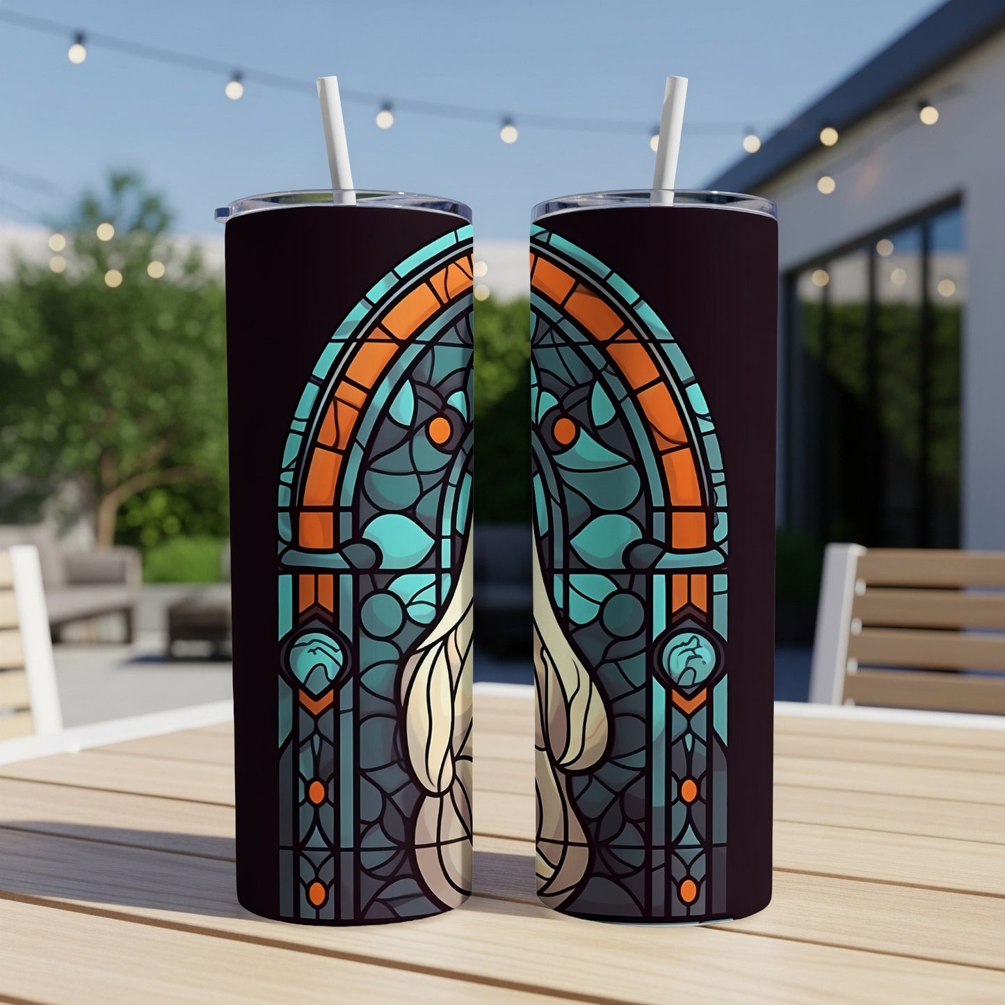 Two dark tumblers with stained-glass floral design and straws.