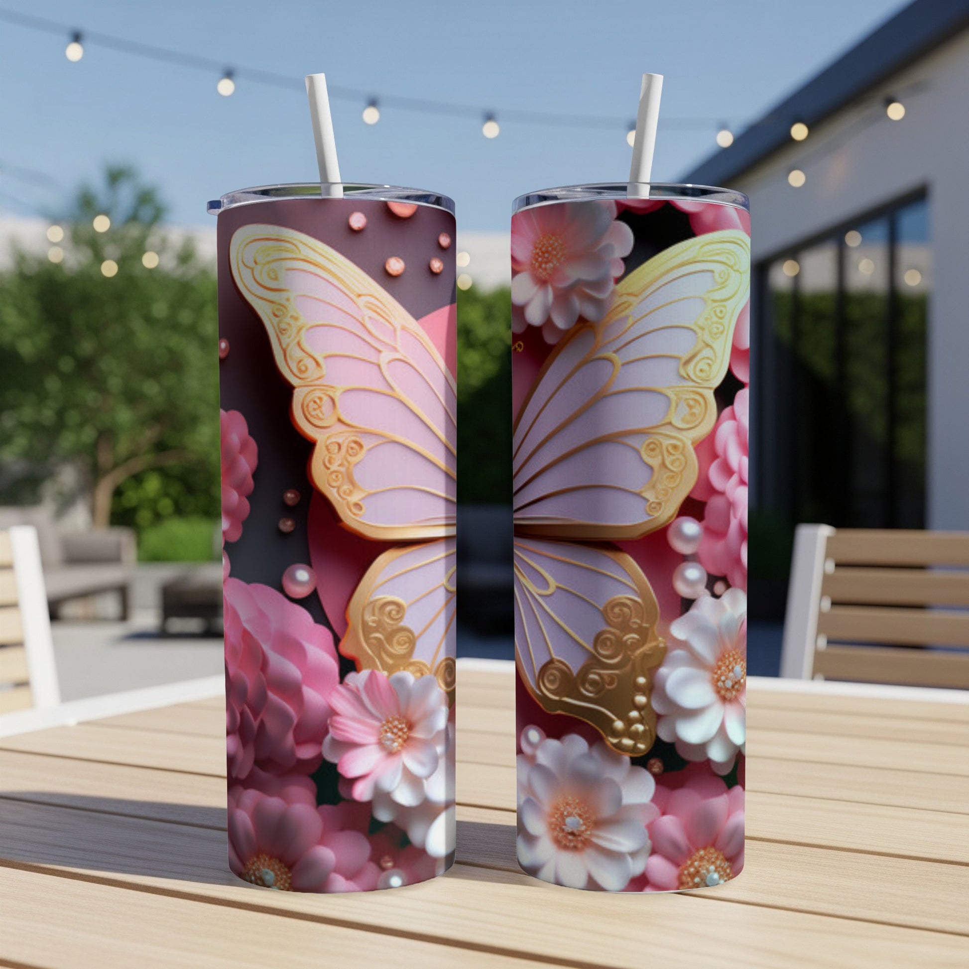 Pink butterfly and floral design on two tall tumblers.