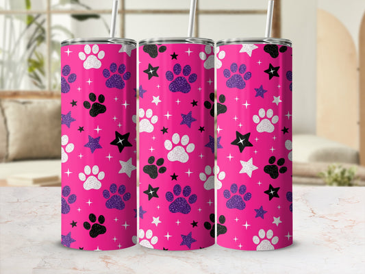 Pink tumbler with white, black, and glitter paw prints and stars.