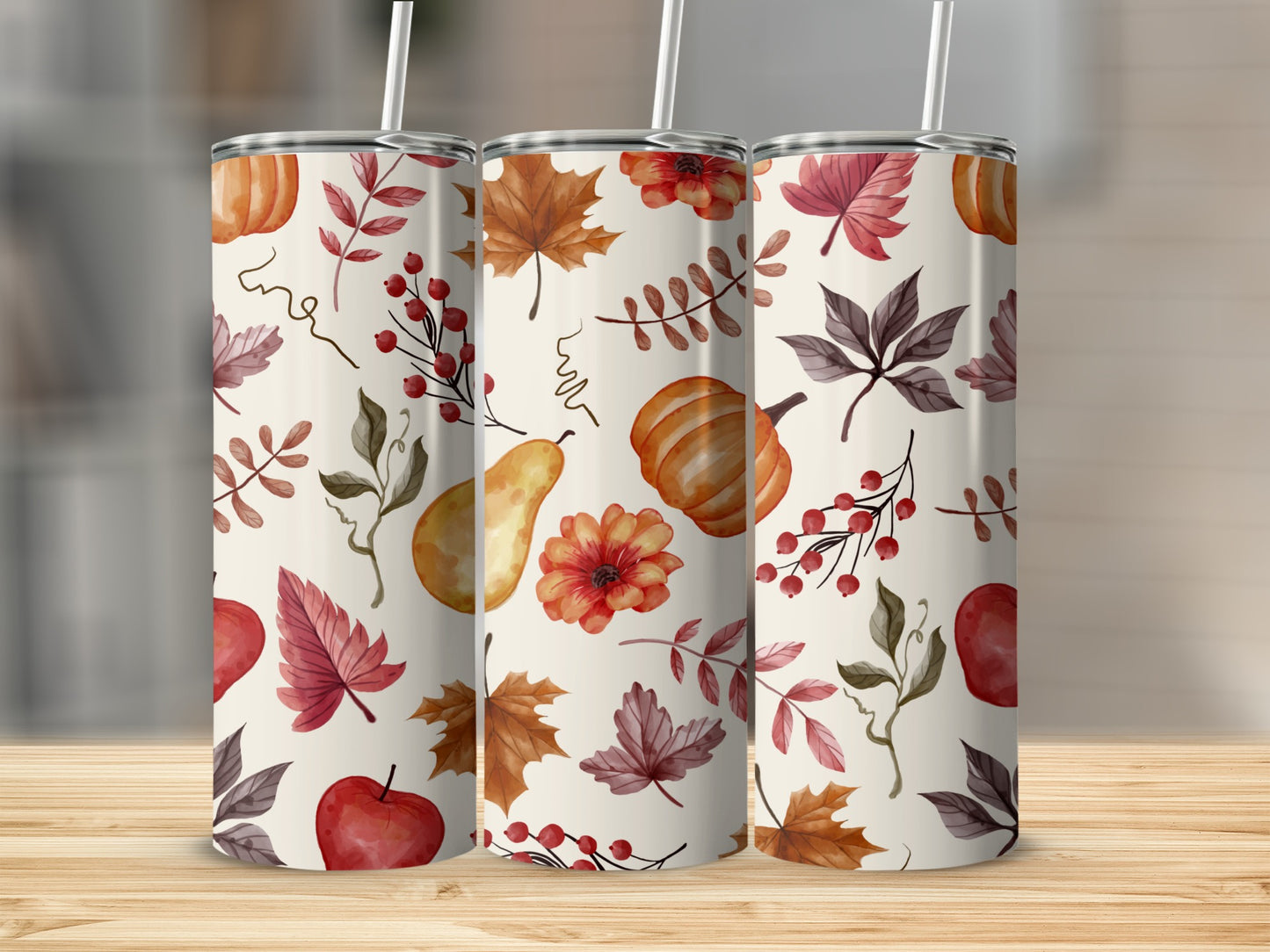 Three tumblers with autumn leaf and pumpkin pattern.