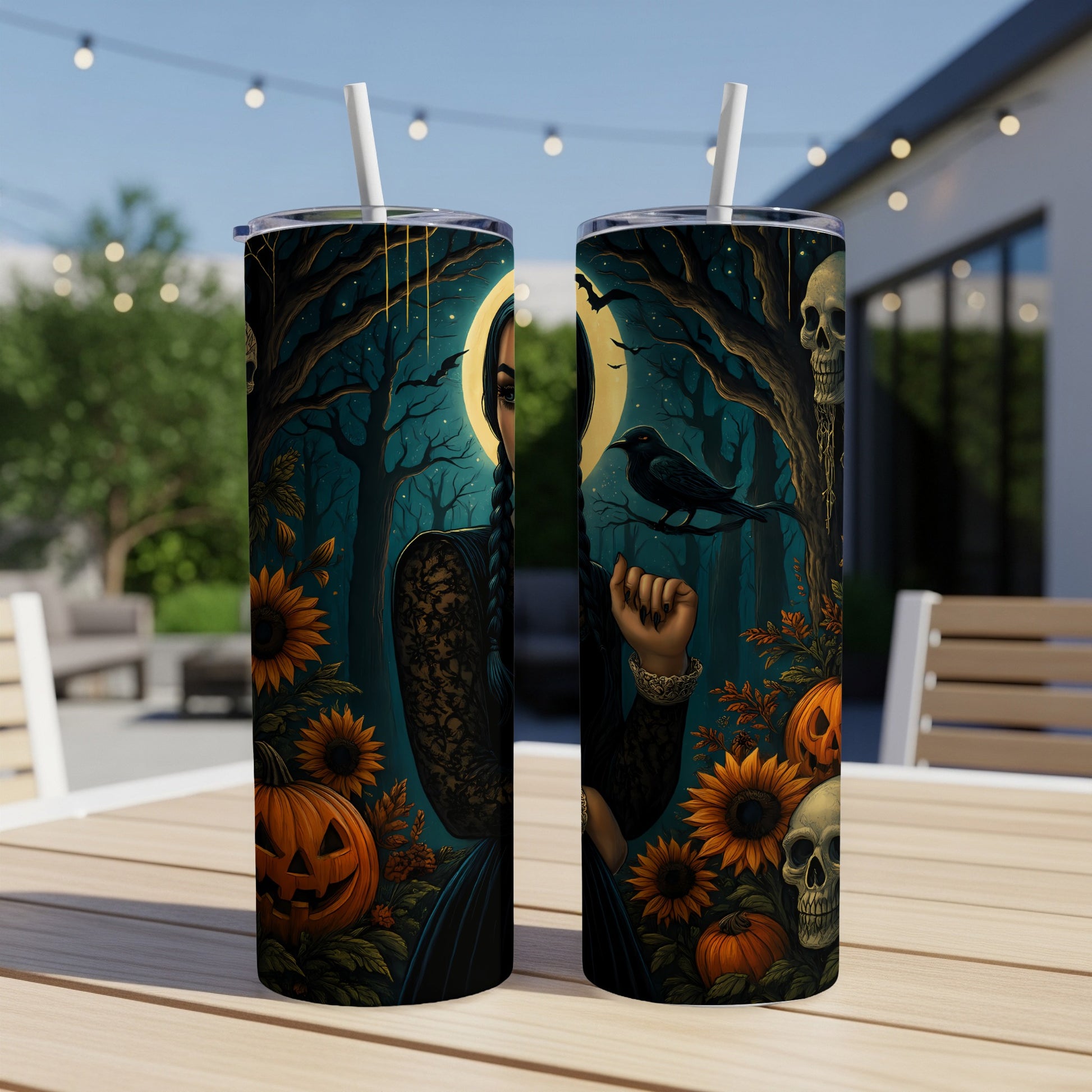 Two tumblers with Halloween-themed artwork featuring a stylized woman, crow, skulls, pumpkins, and sunflowers.