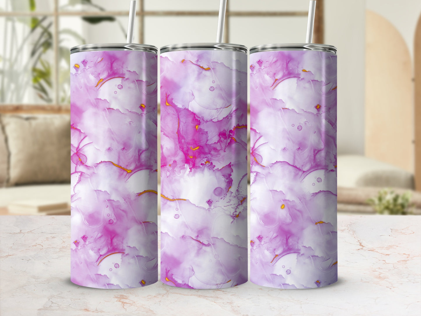 Three tumblers with a pink, purple, and gold abstract watercolor design.