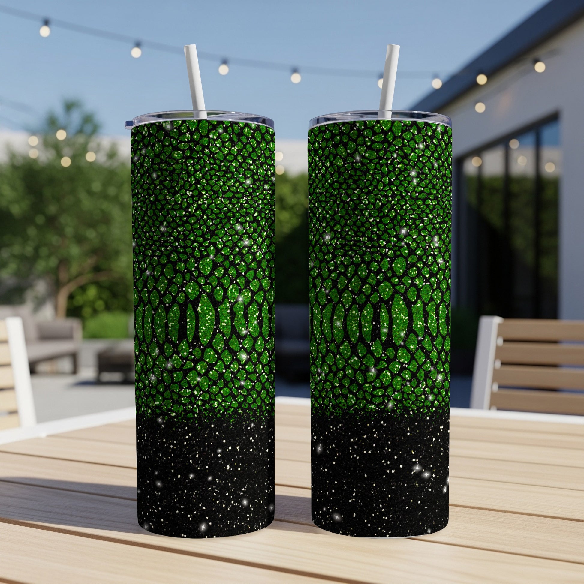 Green snake skin pattern and black glitter tumbler with straw.