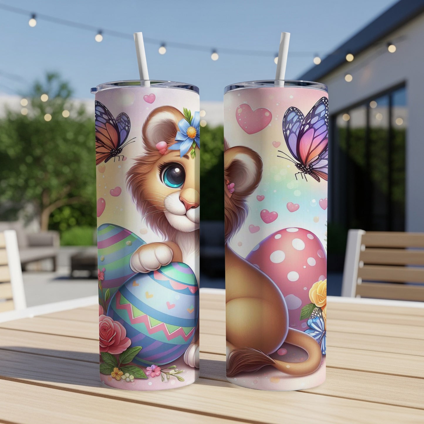 Two Easter-themed tumblers with a cartoon lion cub, colorful eggs, and butterflies.