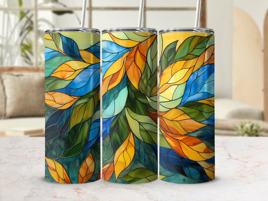 Three tumblers with a stained glass leaf pattern, in blues, greens, and oranges.