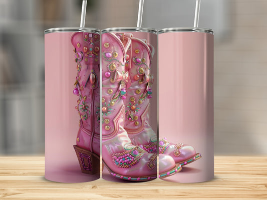 Pink embellished cowboy boots on a pastel pink background.