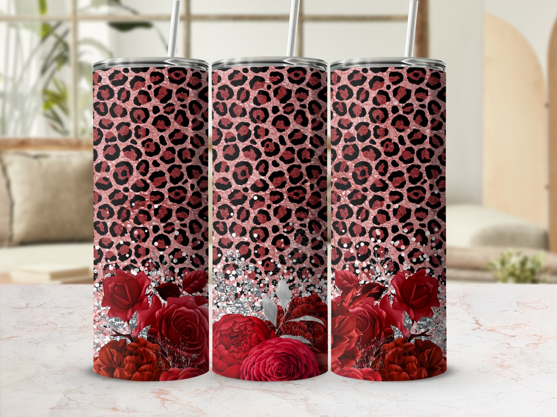 Pink leopard print tumbler with red roses and glitter accents.