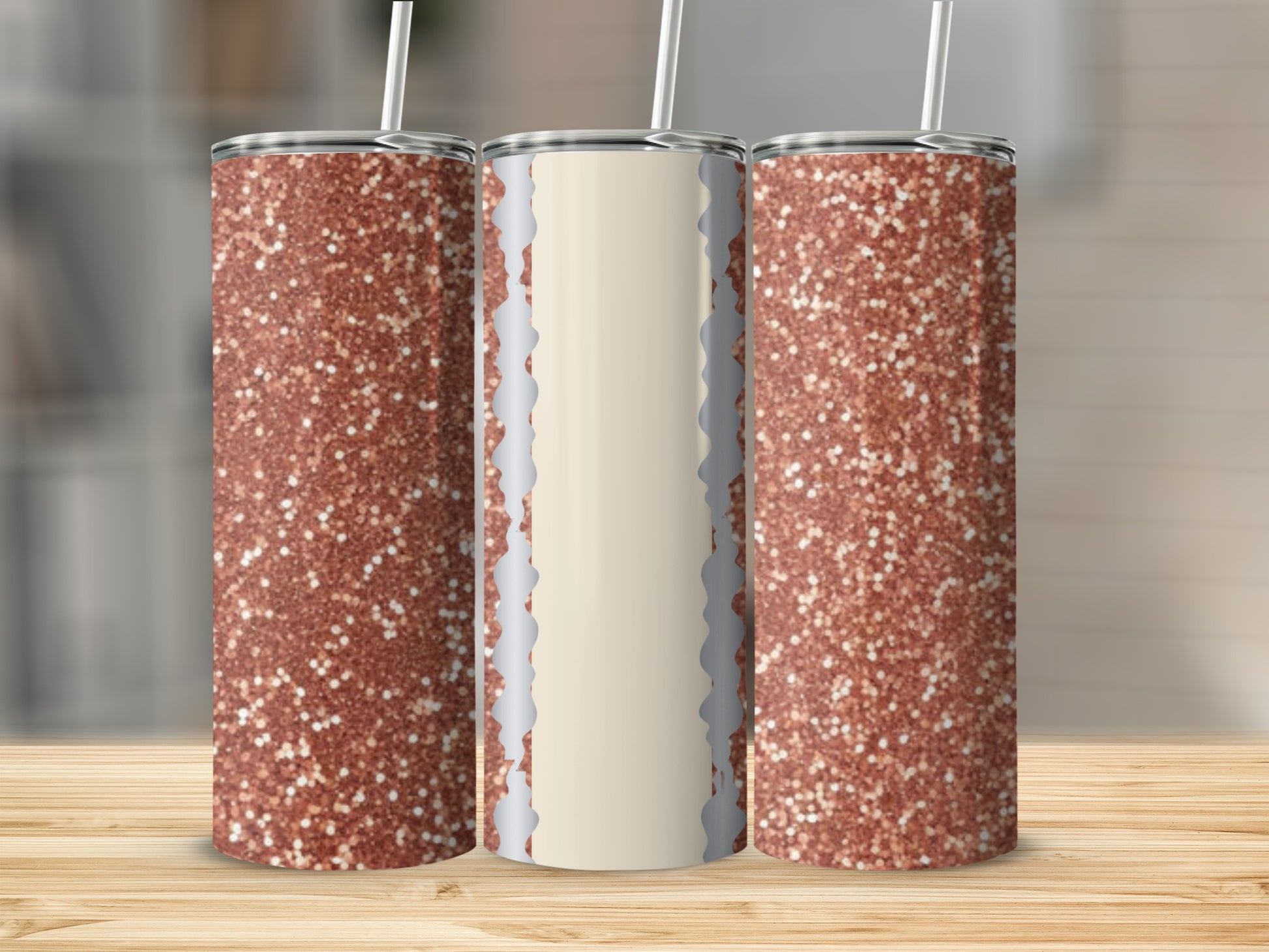 Three rose gold glitter tumblers with white and gray accents, displayed on a wooden surface.