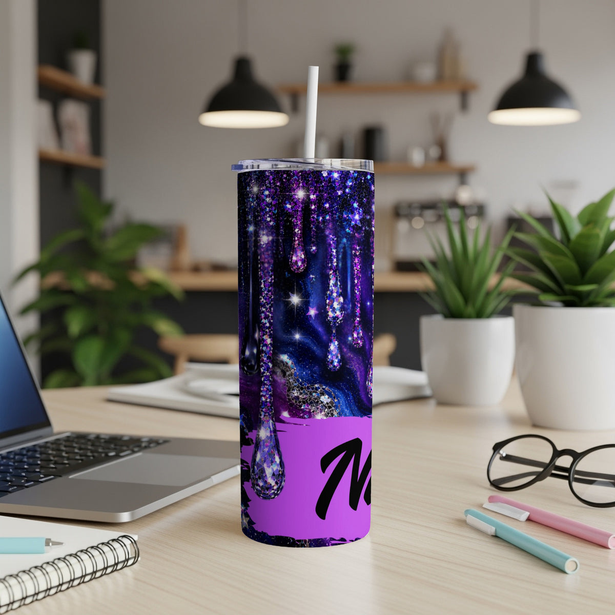 Purple galaxy glitter tumbler with dripping effect and black "M" text.