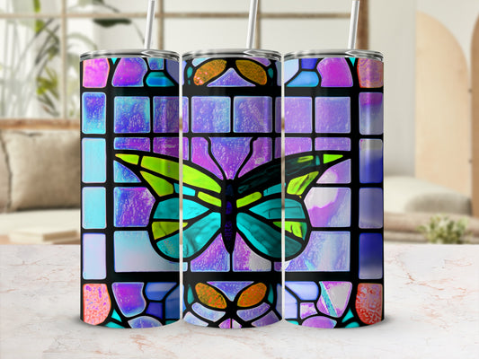 Stained glass butterfly design on three tumblers with straws.