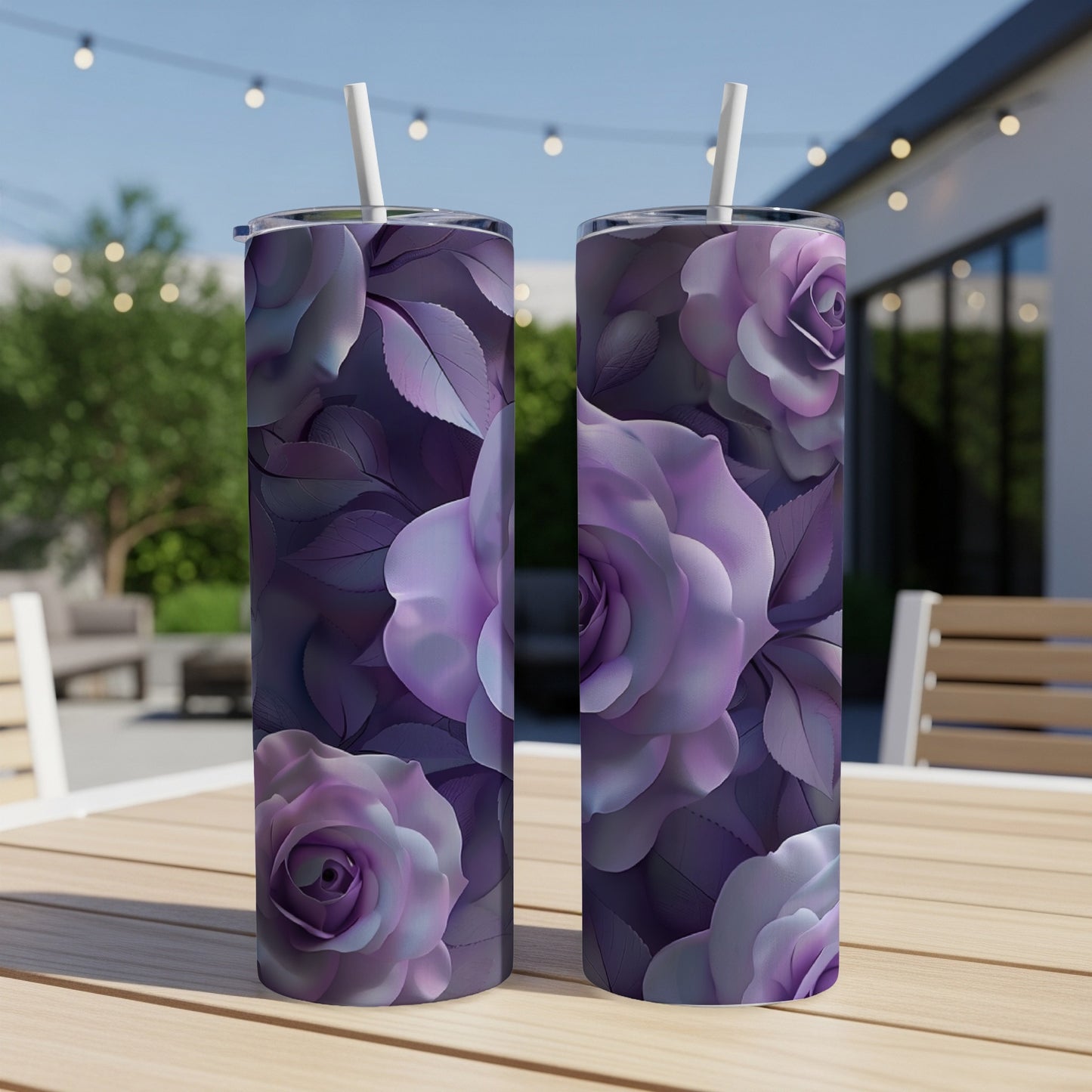 Two purple rose tumblers with straws on a wooden table outdoors.