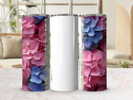 White tumbler with pink and blue hydrangea floral pattern and glitter accents.
