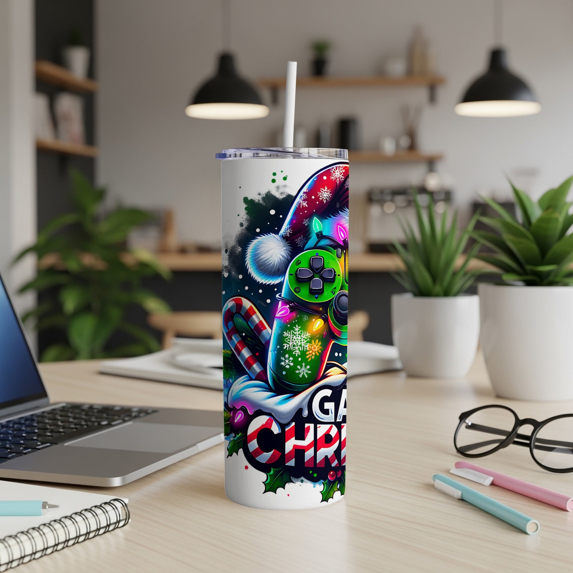 Gaming controller and candy cane design on a skinny tumbler with straw.