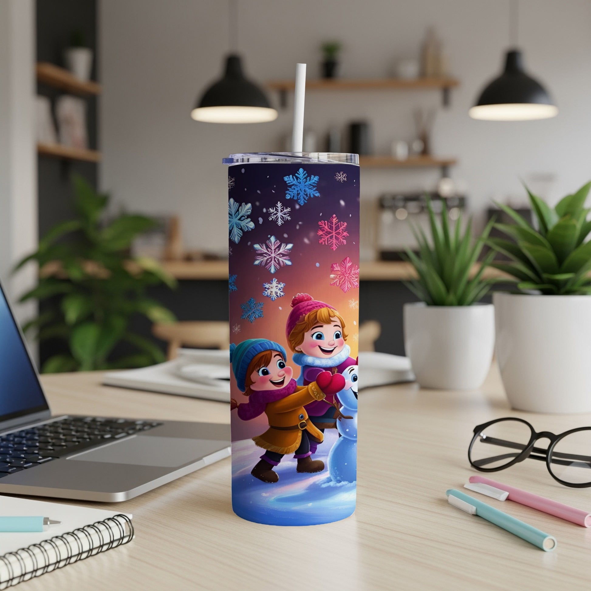 Children build a snowman surrounded by colorful snowflakes on a blue tumbler.