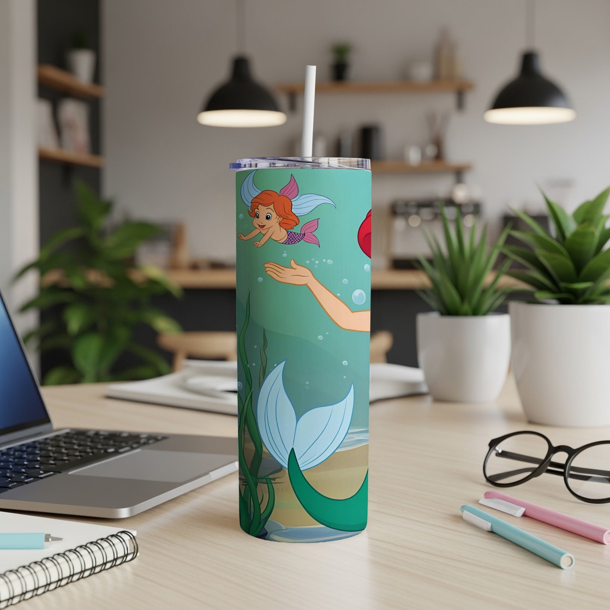 Ariel the Little Mermaid on a teal tumbler with cartoon ocean background.