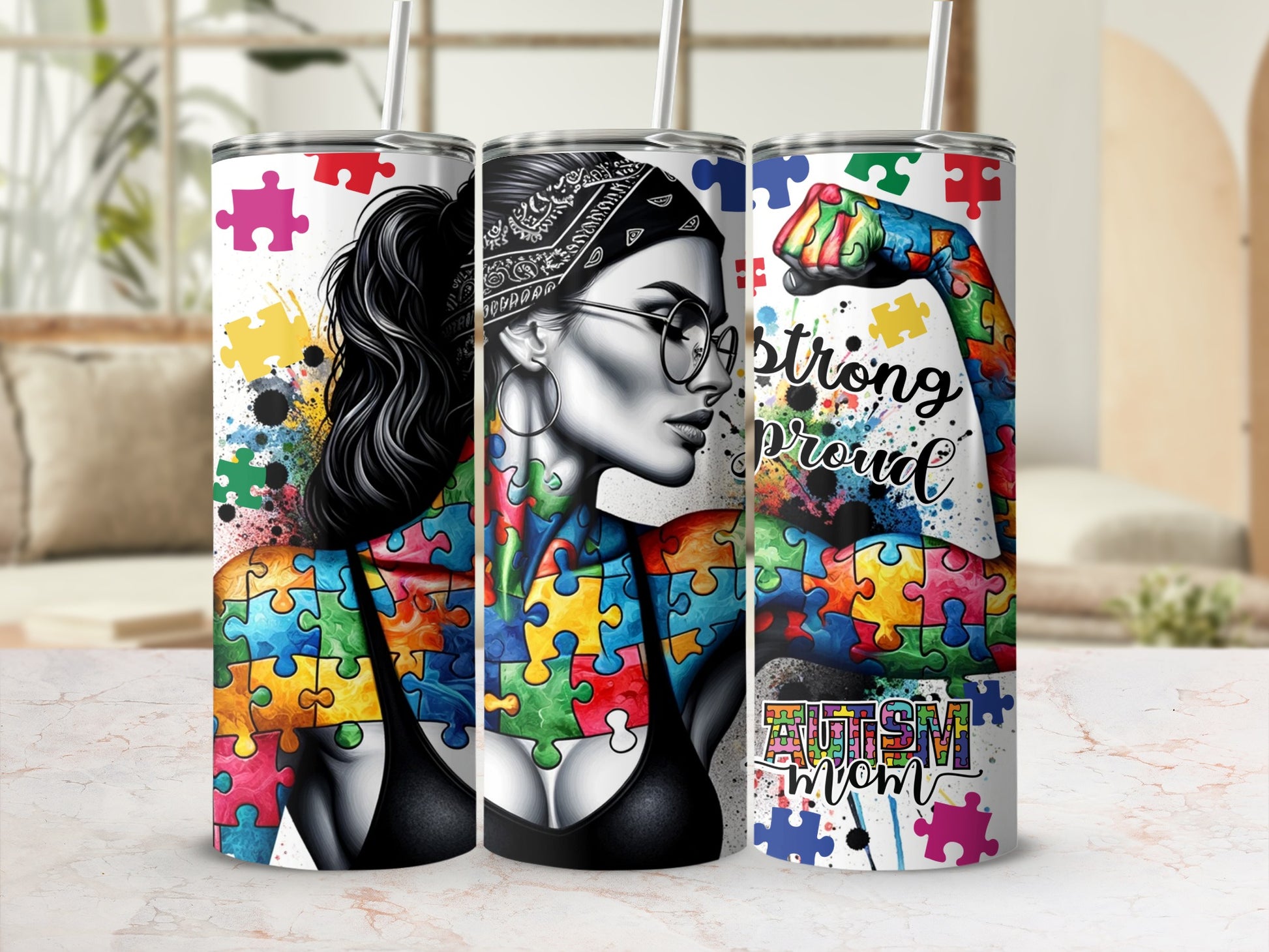 Woman's torso with autism puzzle pieces and text "strong proud autism mom."