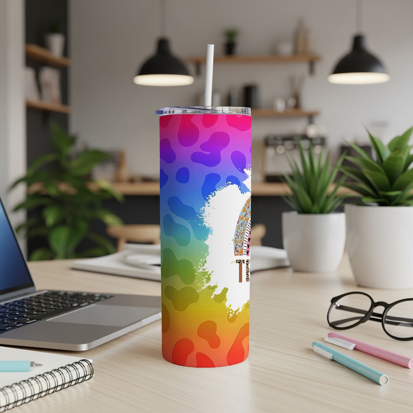 Rainbow tie-dye tumbler with leopard print and "Tired" text.