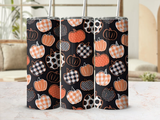 Three tumblers with various pumpkin patterns: plaid, polka dots, and solid orange.