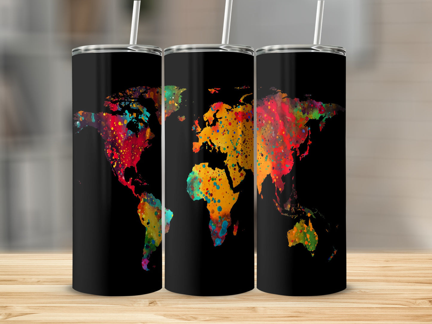 Three tumblers with colorful watercolor world map designs on black.