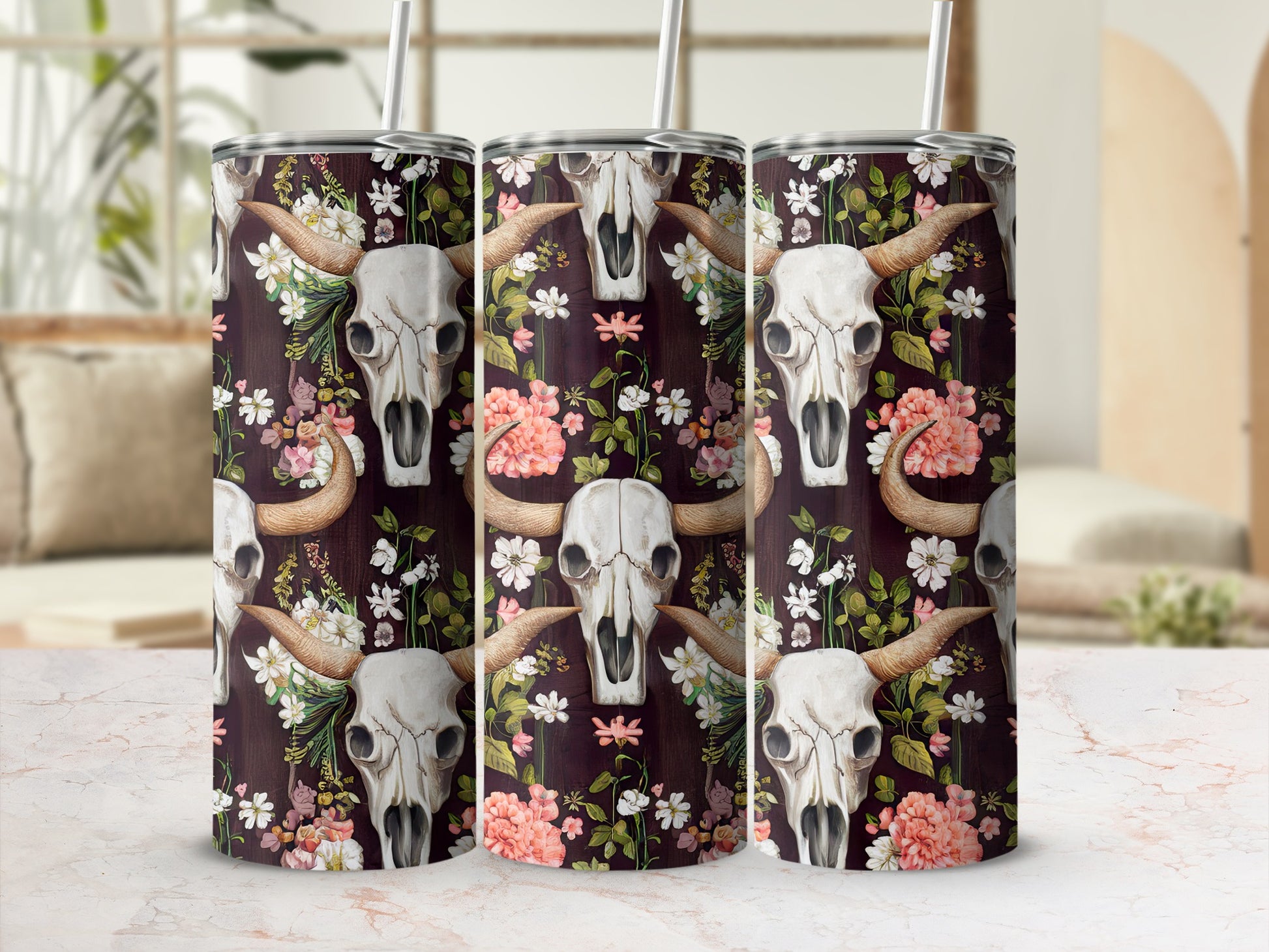 Cow skull floral pattern on a tumbler with straw.