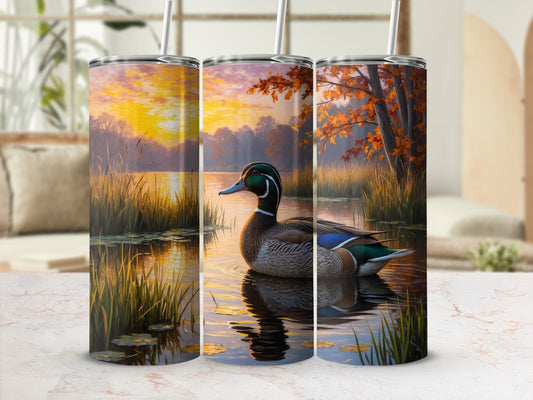 Mallard duck in serene lake during sunset with autumn trees.