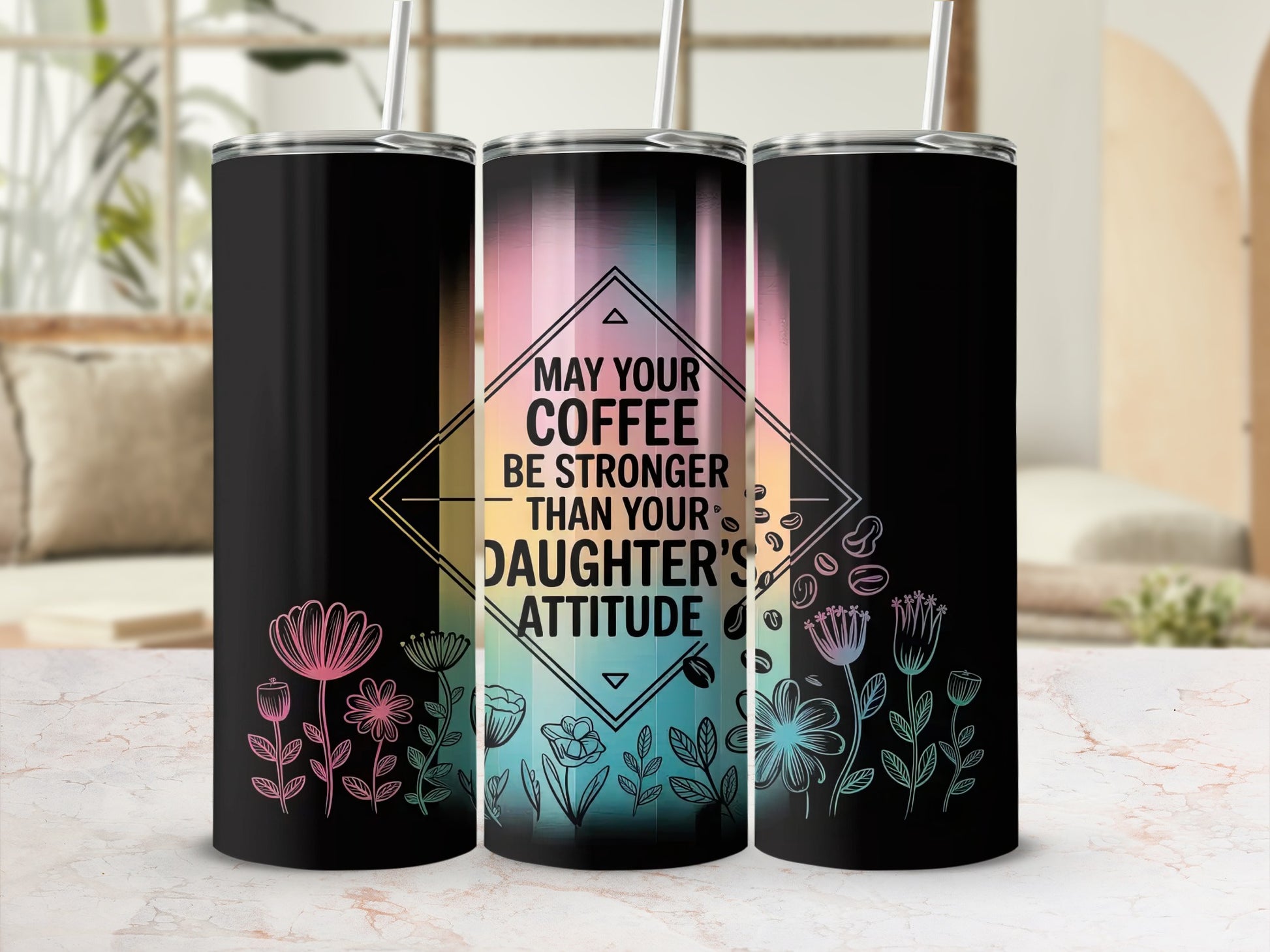 Black tumbler with floral accents and text "MAY YOUR COFFEE BE STRONGER THAN YOUR DAUGHTER'S ATTITUDE".
