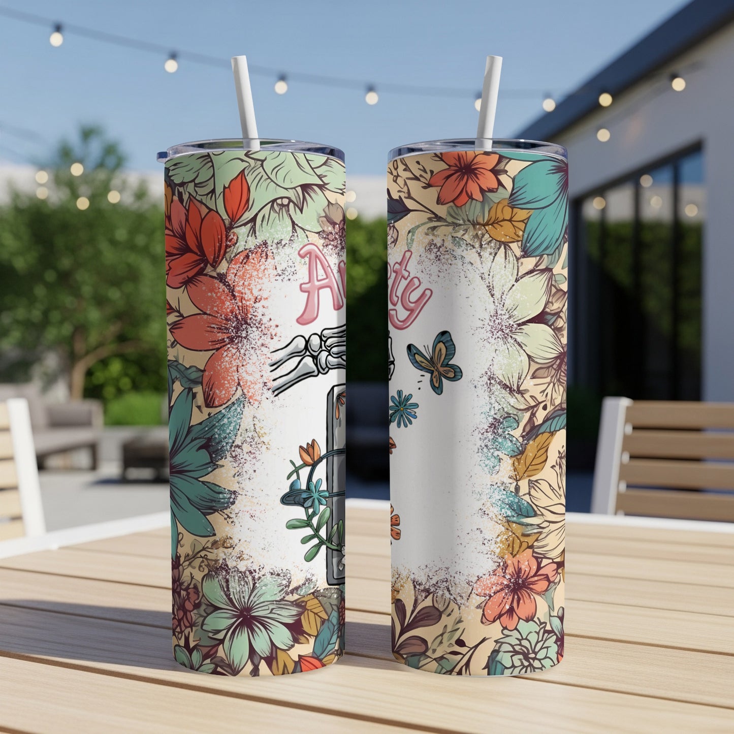 Two tall tumblers with floral designs and "Auntie" text.