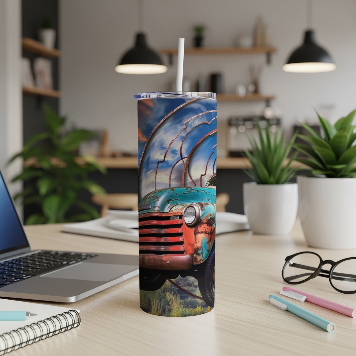 Distressed vintage turquoise truck on a tumbler with a sunset sky design.