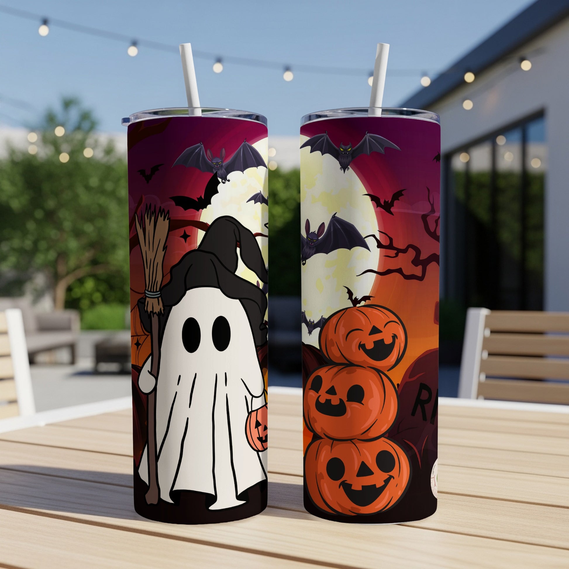 Two Halloween tumblers with ghosts, bats, pumpkins, and a full moon.
