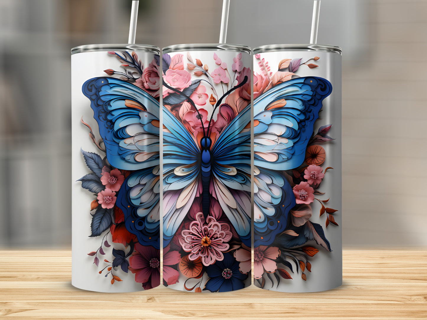 Three tumblers with blue butterfly and floral designs.