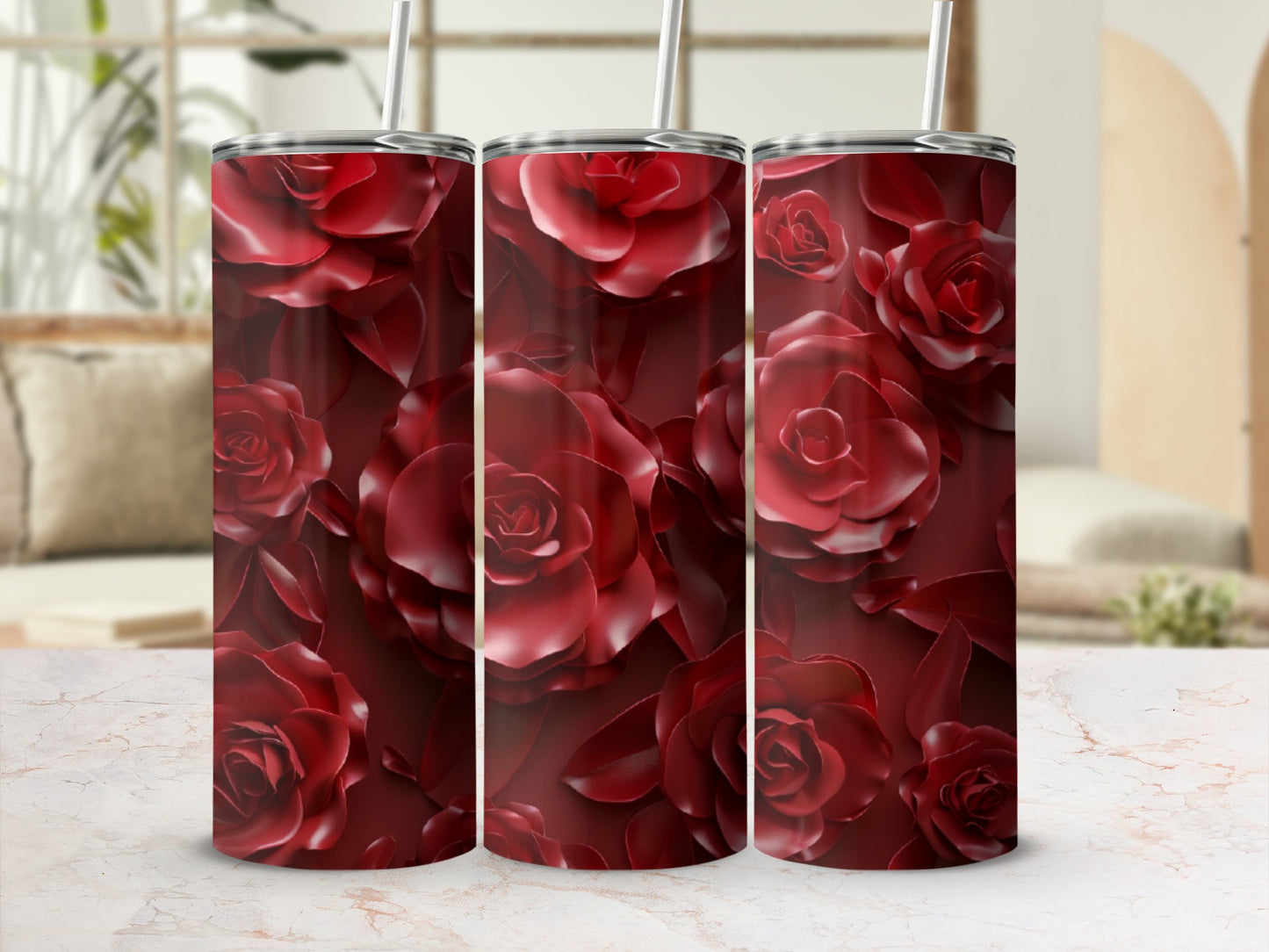 Red rose floral pattern on a stainless steel tumbler.
