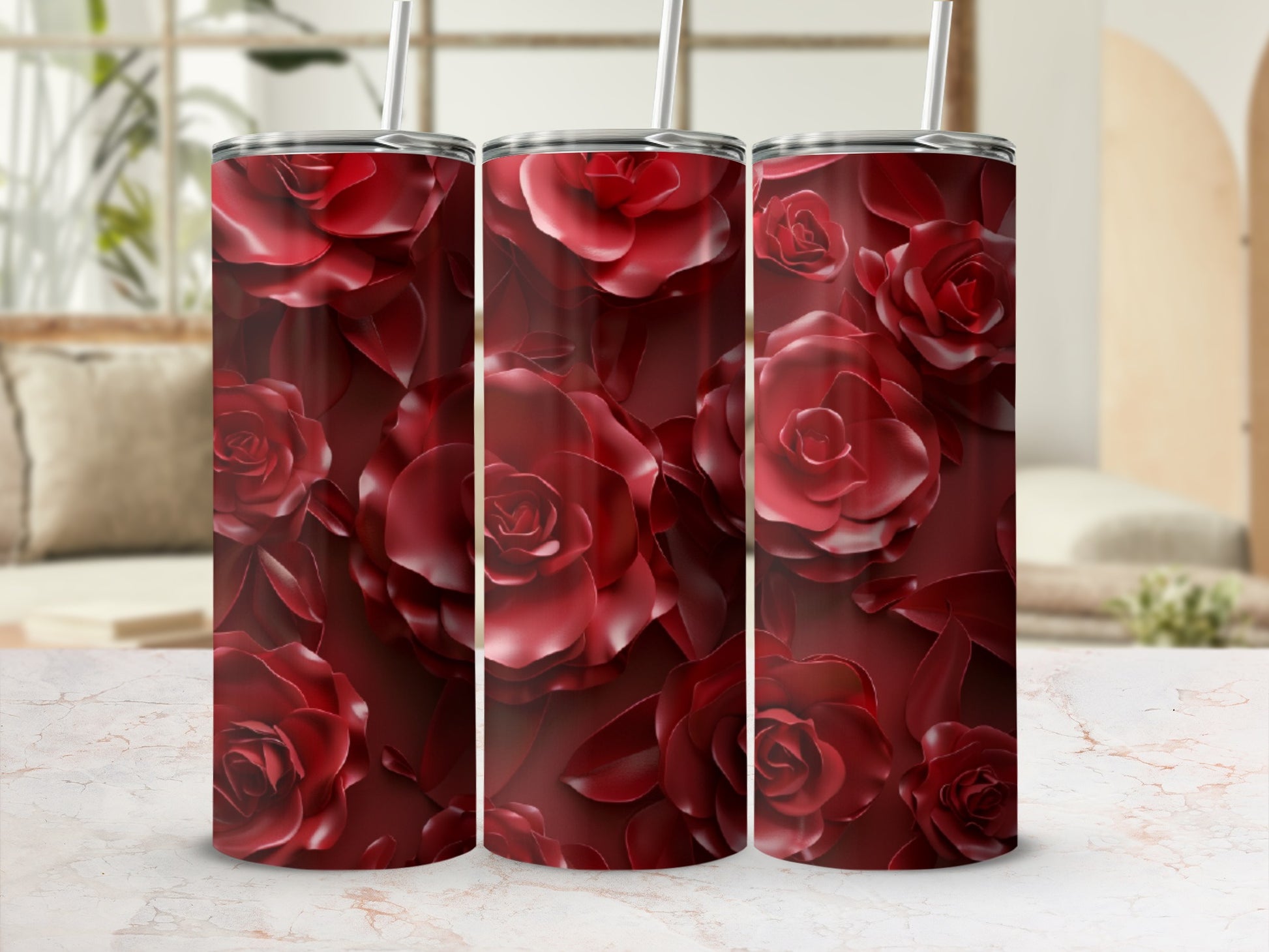 Red rose floral pattern on a stainless steel tumbler.