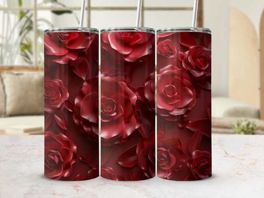 Red rose floral pattern on a stainless steel tumbler.
