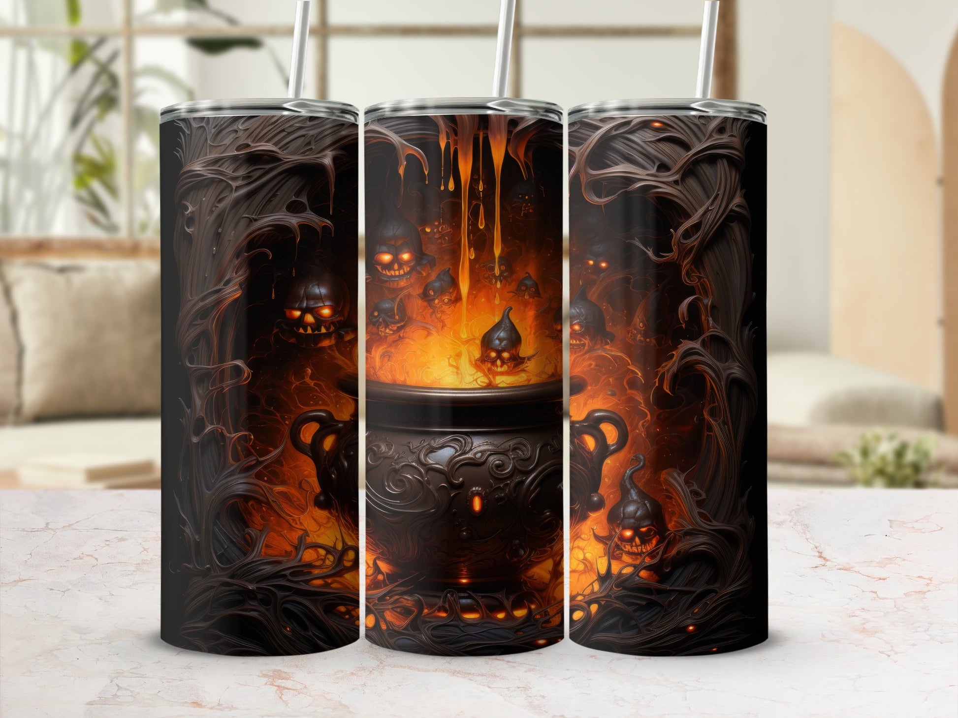 Three tumblers with a dark, fiery cauldron and grinning skull design.