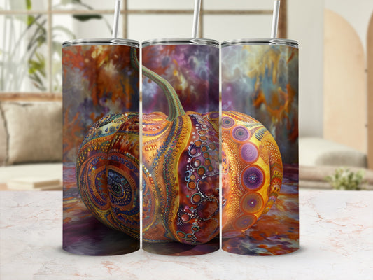 Three patterned tumblers with a pumpkin design in a mock-up setting.