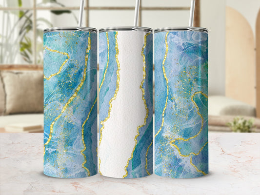 Three tumblers with blue, white, and gold marbled abstract pattern.