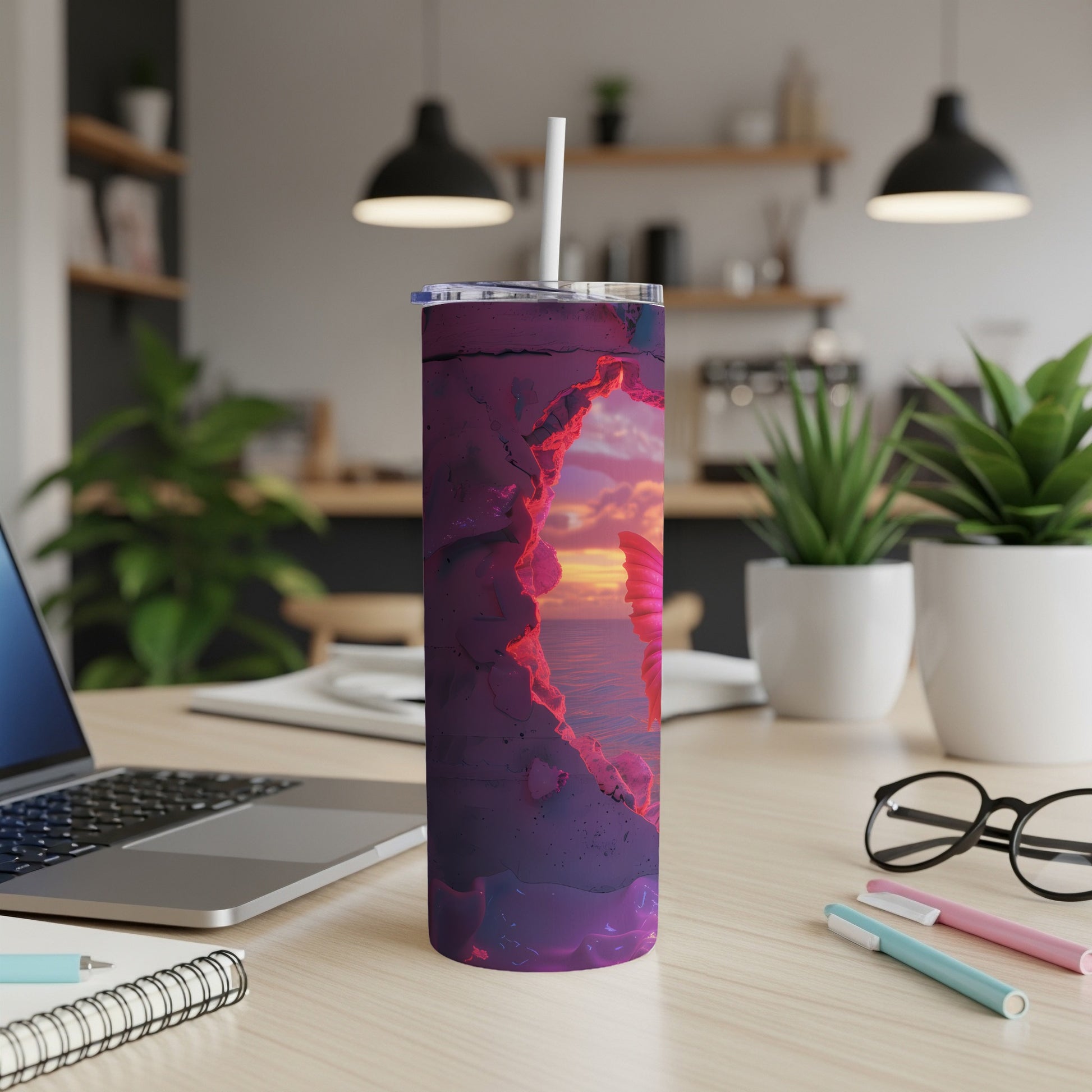 Purple tumbler with a swirling abstract design sitting on a desk.